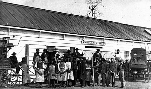 Workmen in front of the Ambulance Shop